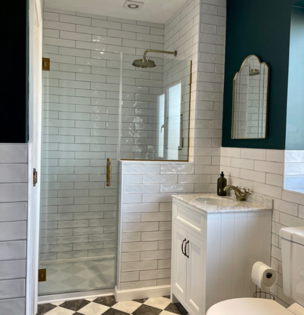 Shower door with fixed panel designed to sit on any or half wall.